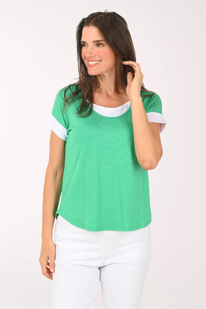 Woman wearing a green short sleeve shirt