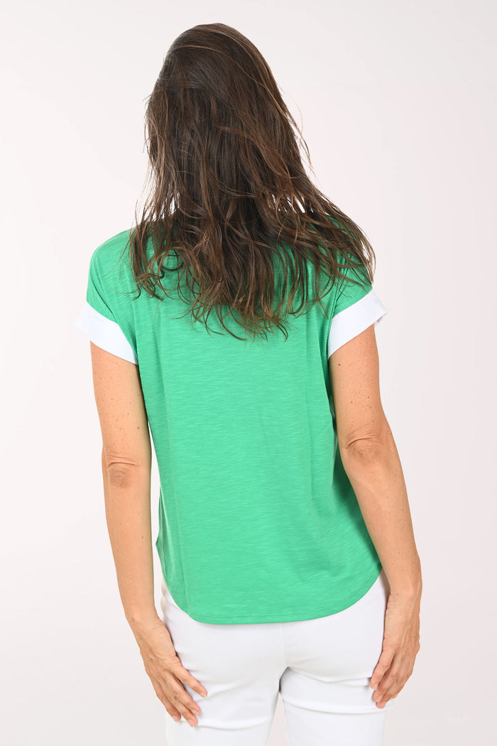 Woman wearing a green short sleeve shirt