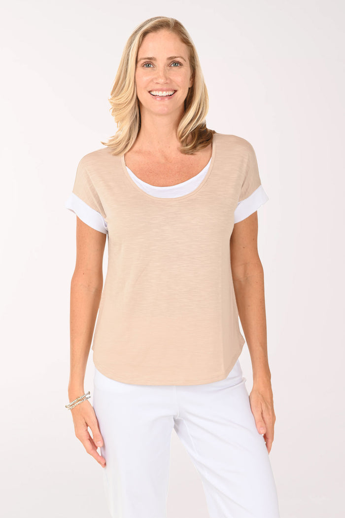 Woman wearing a beige short sleeve shirt