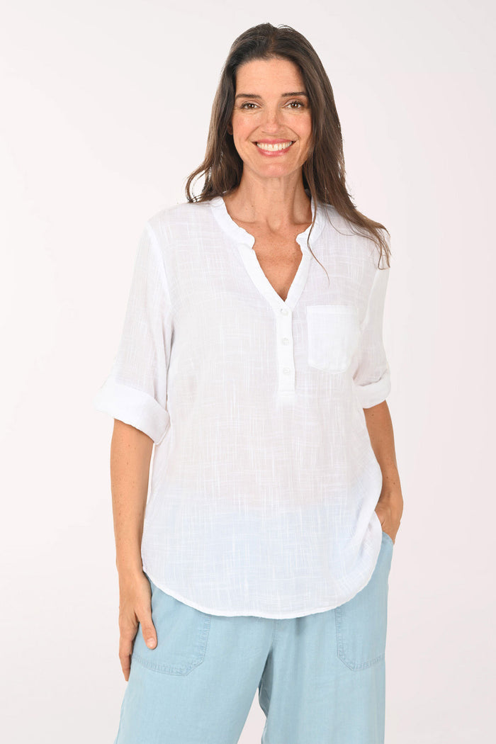 Woman wearing a 3/4 roll sleeve white blouse