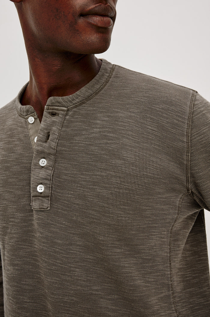 Soto Henley in Cotton French Rib Blend With 4-Button Placket, Tonal Seam Detailing, and Long Sleeves in Crossroad Colorway - Upper Body Close Up View Featured on Model