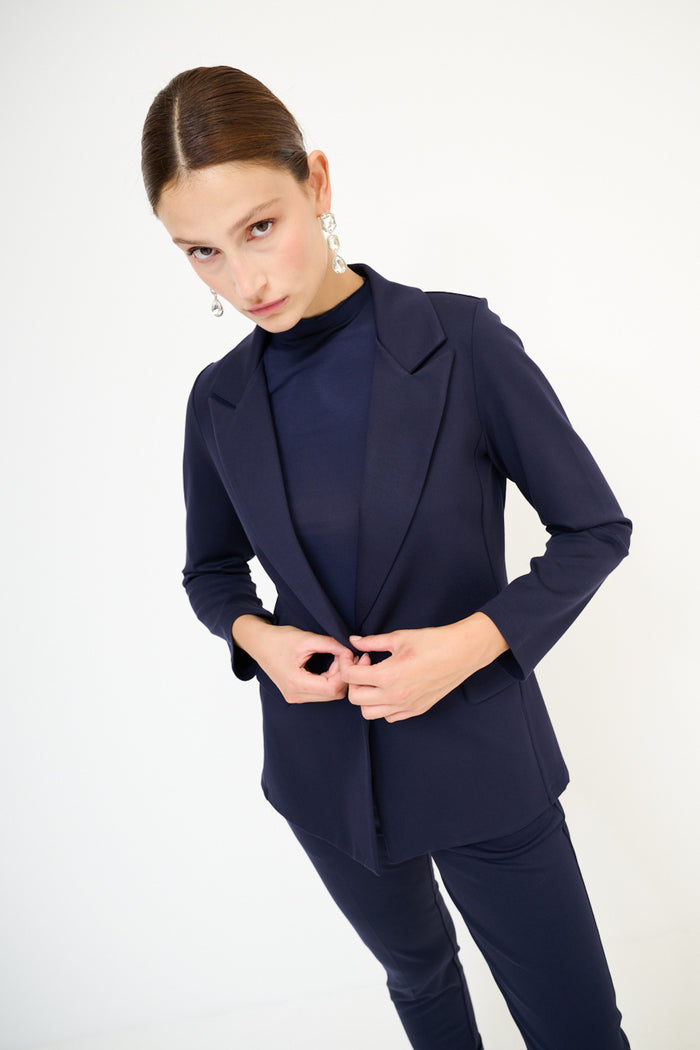 Tailored navy blazer with classic lapels and flap pockets wholesale
