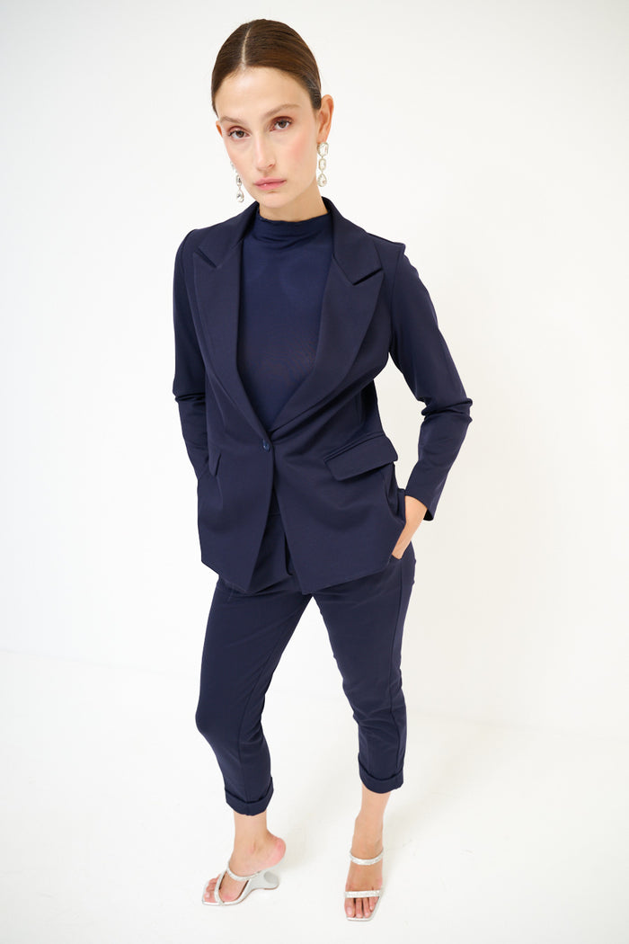 Tailored navy blazer with classic lapels and flap pockets wholesale