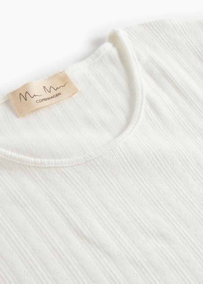 White pointelle blouse for women with long sleeves