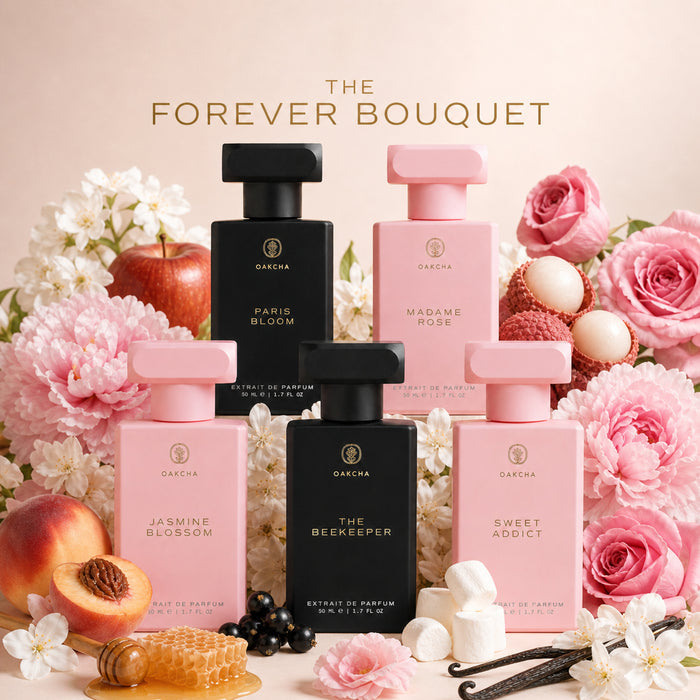 Front view of The Forever Bouquet five-bottle extrait de parfum set showcasing pink and black bottles with roses, peonies, and peaches