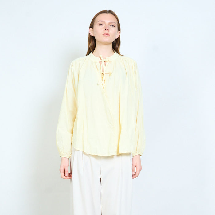 Tie neck blouse with softly gathered yoke and relaxed fit wholesale