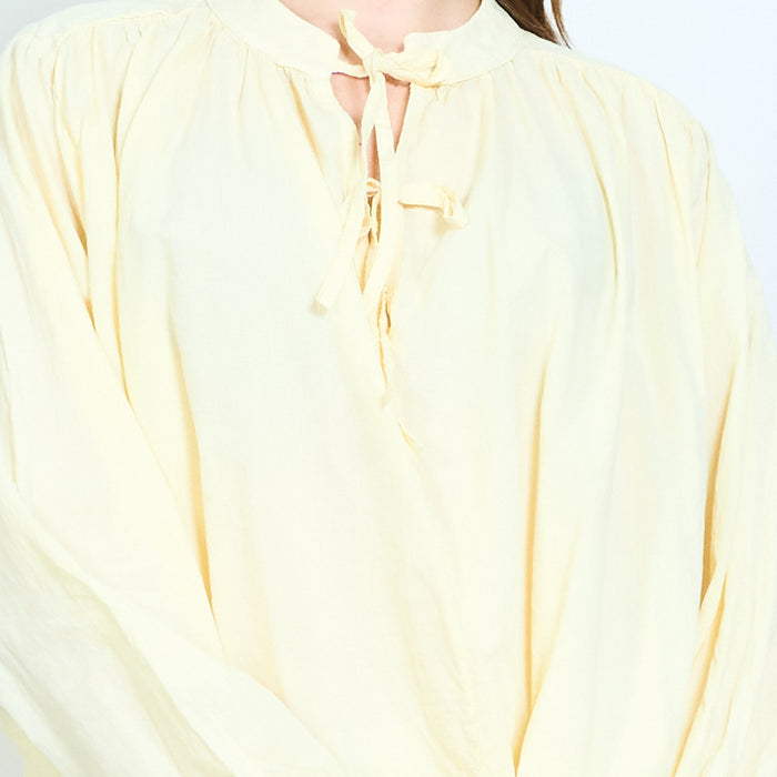 Tie neck blouse with softly gathered yoke and relaxed fit wholesale