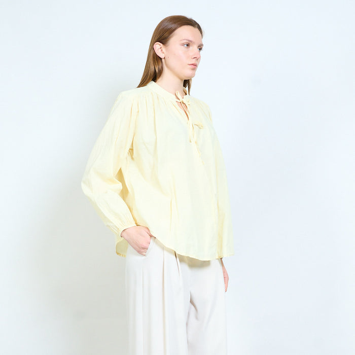Tie neck blouse with softly gathered yoke and relaxed fit wholesale