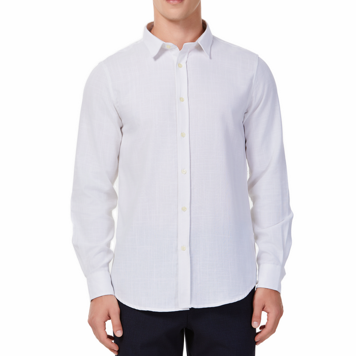 Men's white textured linen long sleeve button up shirt with a pointed collar on a model. Image is cropped to the torso and model is angled to the models right